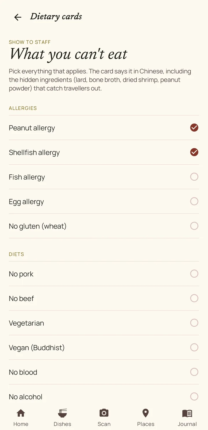 The app's Dietary cards screen, headed What you can't eat, with Peanut allergy and Shellfish allergy ticked in a list of allergies and diets.